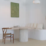 Omega circular dining table in natural travertine