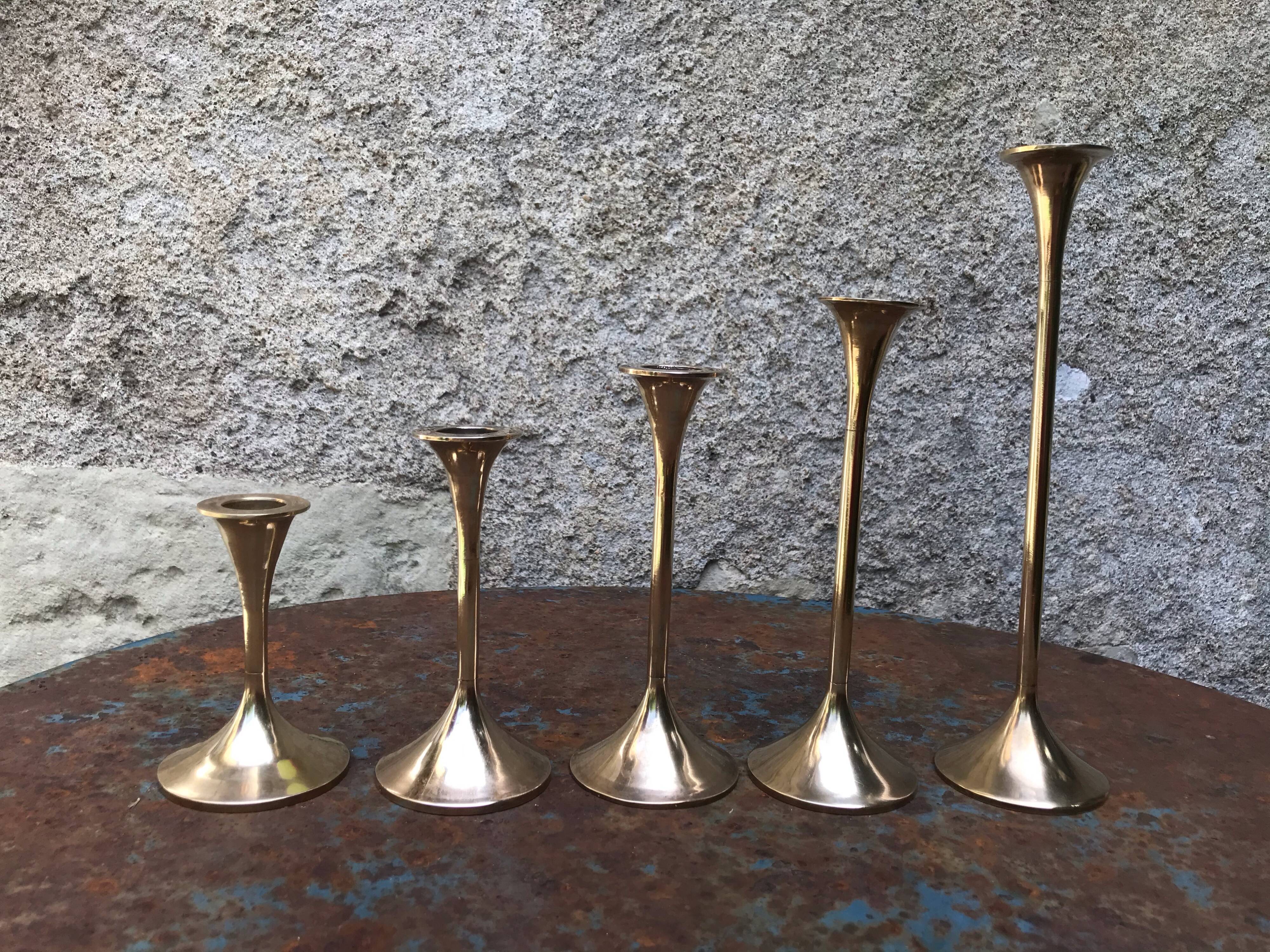 Series of 5 brass candlesticks