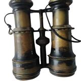 Old brass binoculars with integrated compass