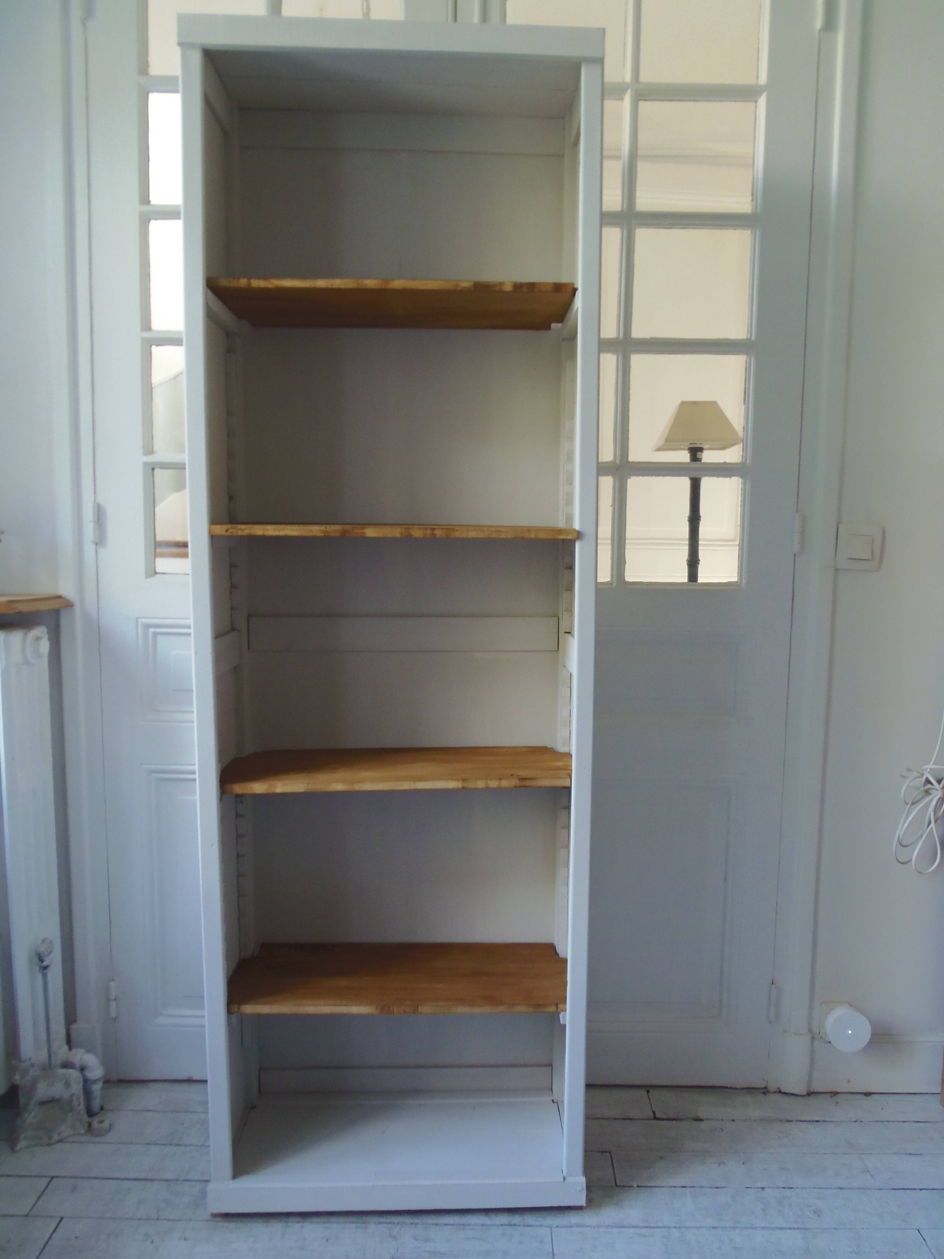Shallow depth bookcase re-enchanted in pearl gray, wooden shelves.