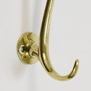 Two curved wall coat racks in brass by Franz Hagenauer, Vienna, mid-20th century, 1950s.