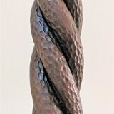 Pair of sculptural cast iron chenets with twisted heads