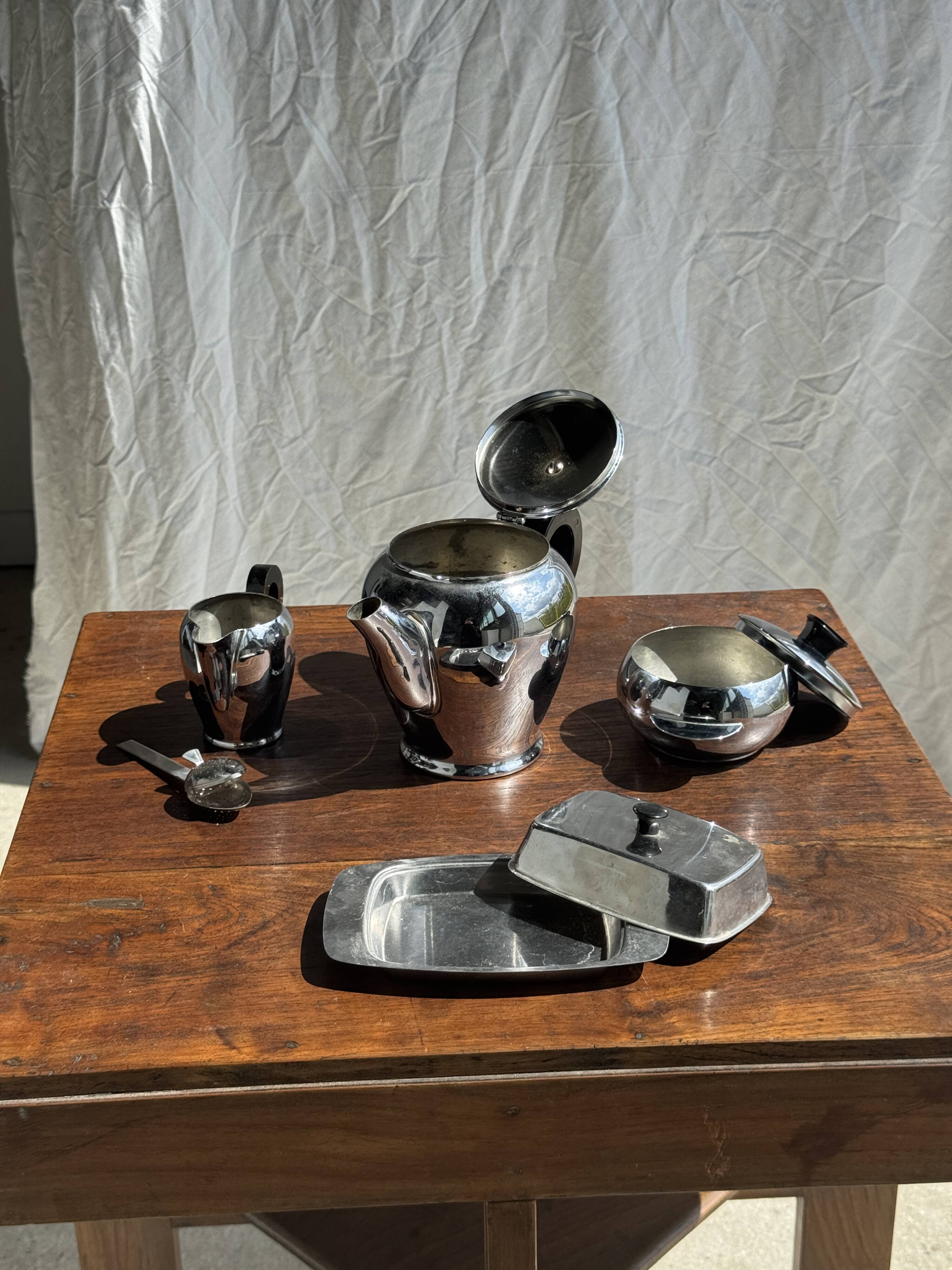 Tea set including teapot, milk jug, sugar bowl and butter dish