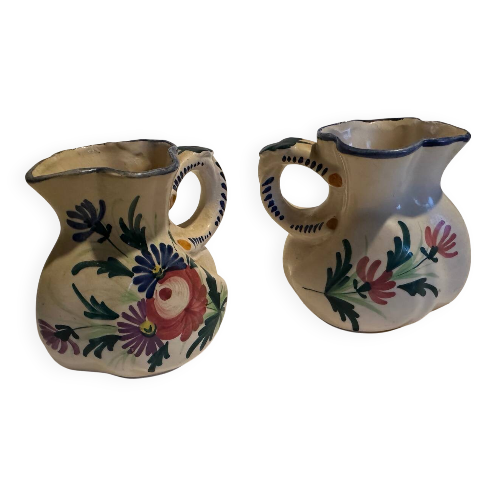 Pair of St Clement pitchers