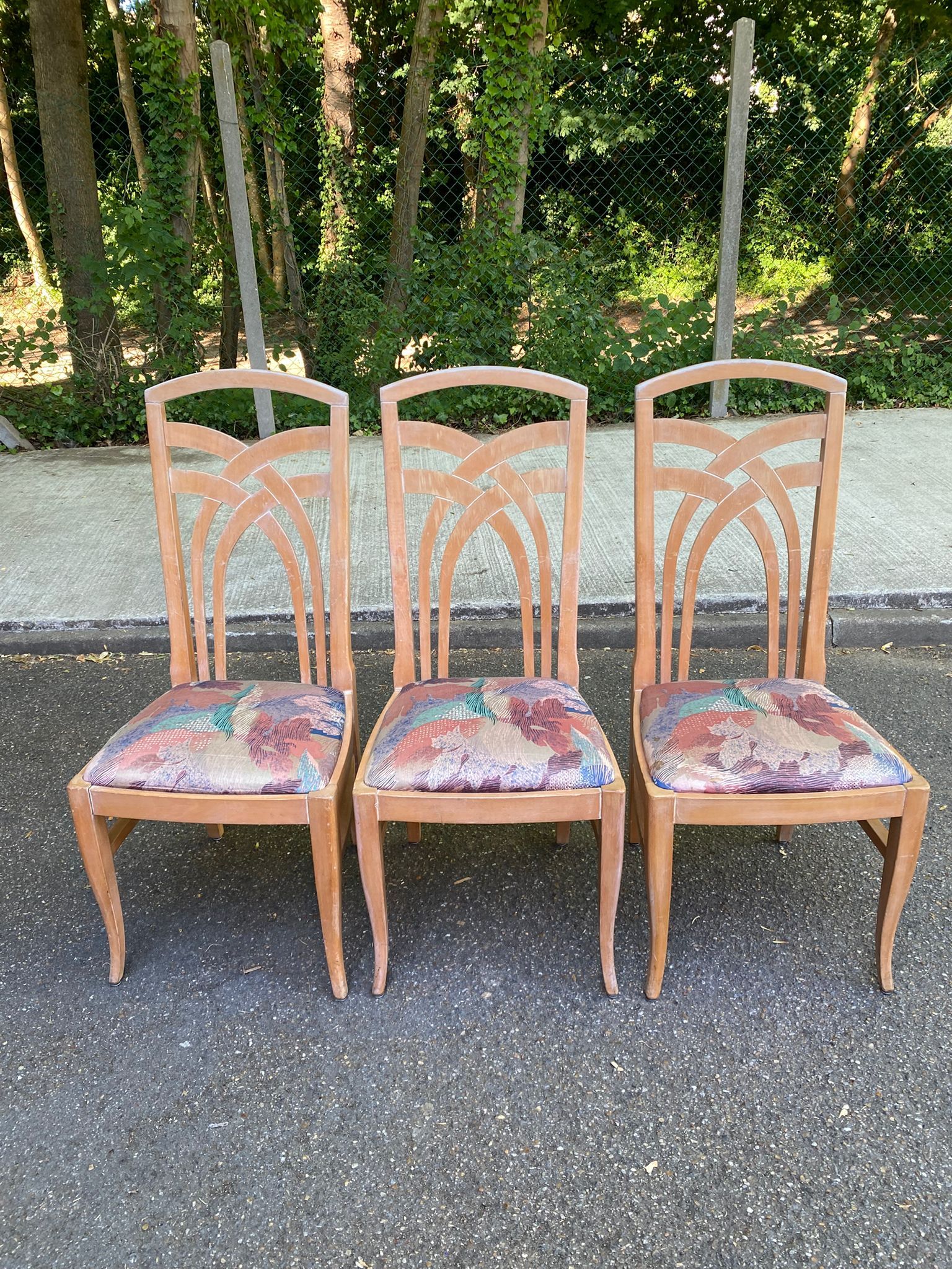 2 dining or kitchen chairs with high backs and fabric.