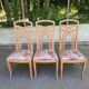 2 dining or kitchen chairs with high backs and fabric.