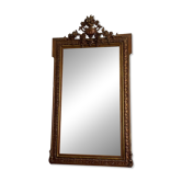 Golden mirror from the late 19th century with a decorated pediment. 150x82.
