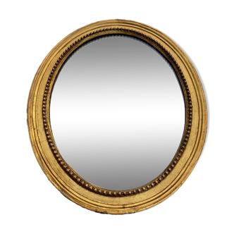 Miroir ovale ancien en bois et résine doré