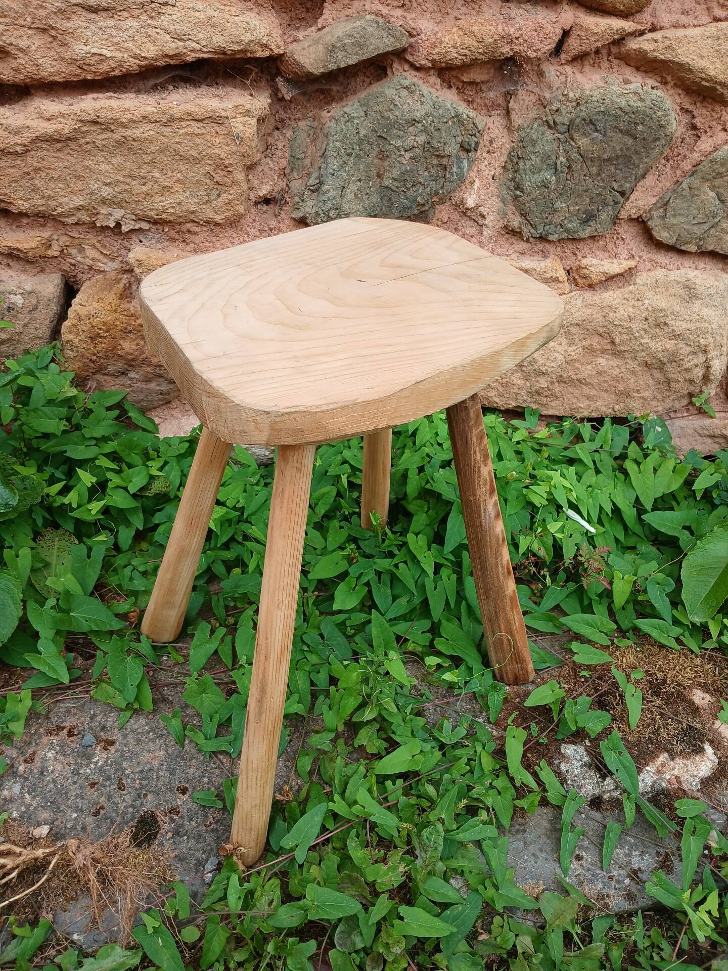 Antique stool in raw wood