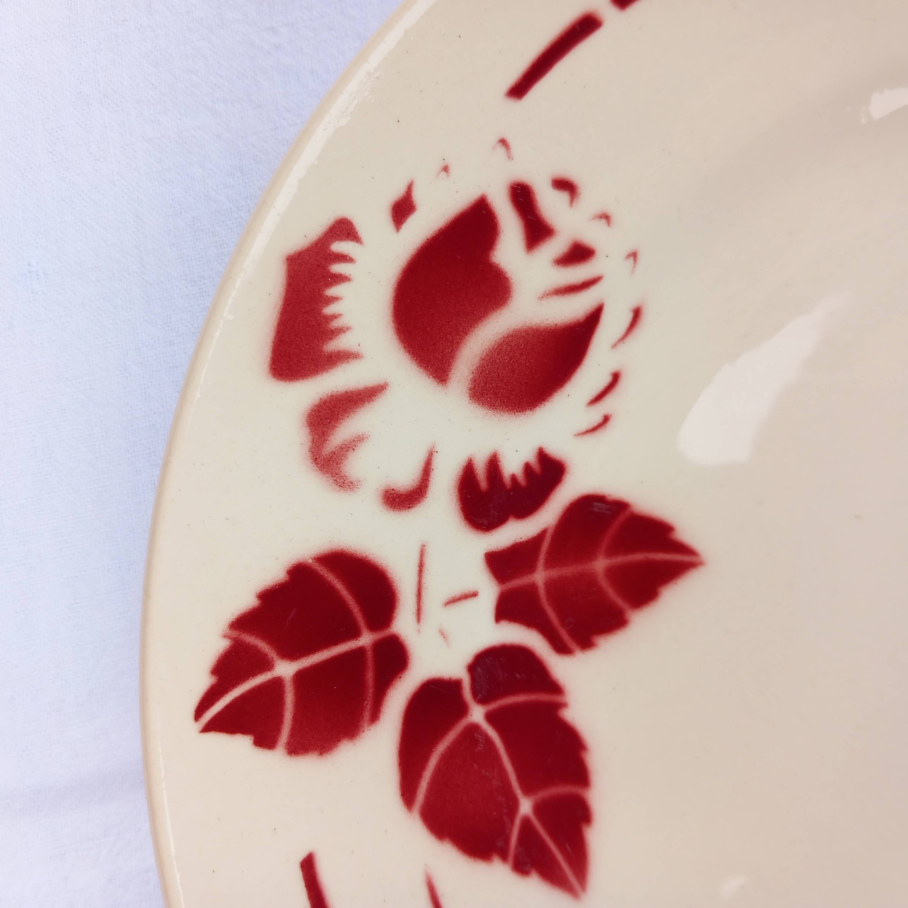 Old presentation plate on red rose foot