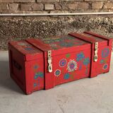 Red wooden trunk with floral patterns
