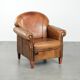 Sheepskin armchair with a beautiful vintage look and decorative nail finish