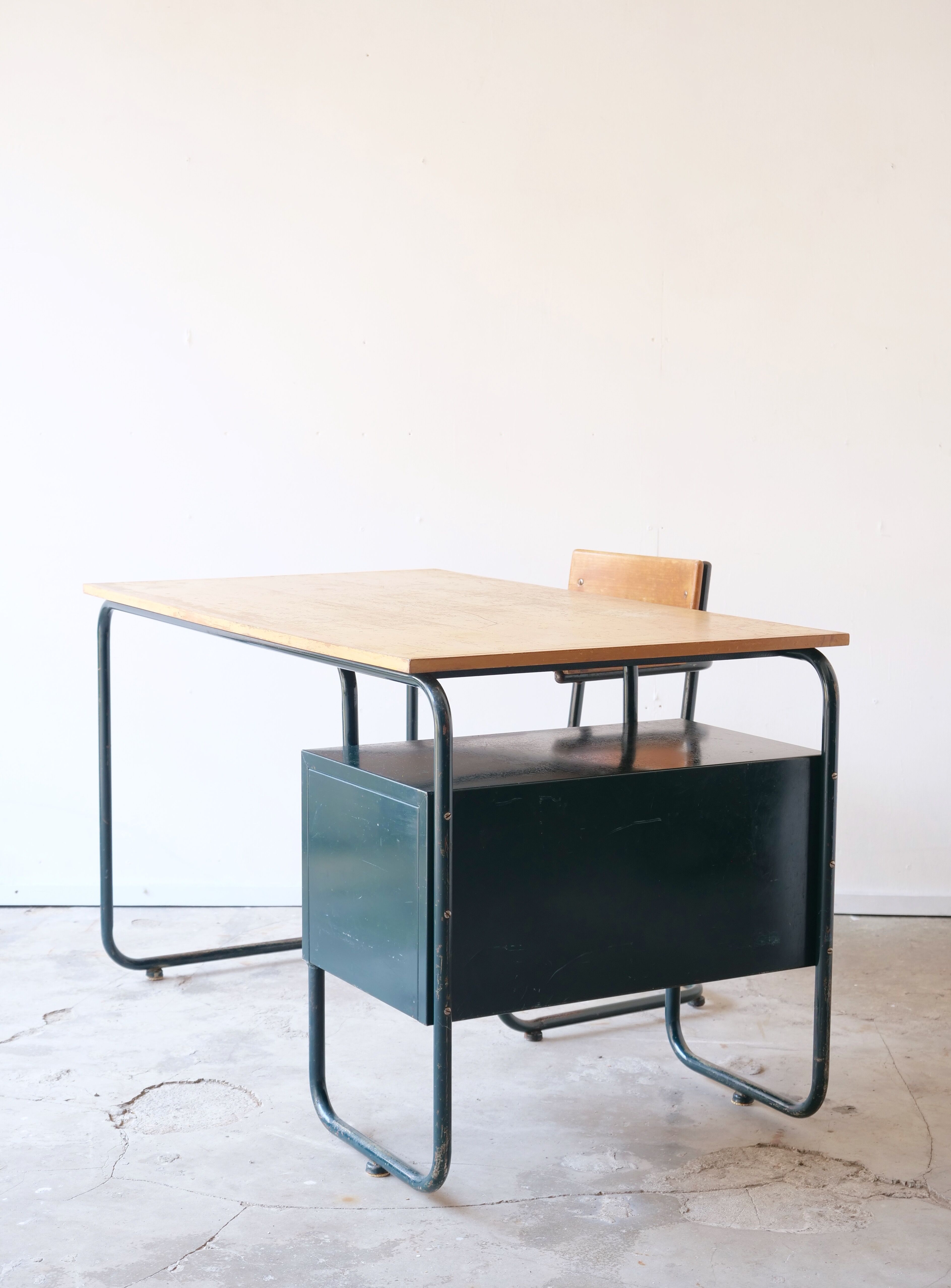 Desk with bauhaus style tubular steel chair