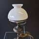 Very pretty lamp in tin with an opaline glass globe in very good condition.