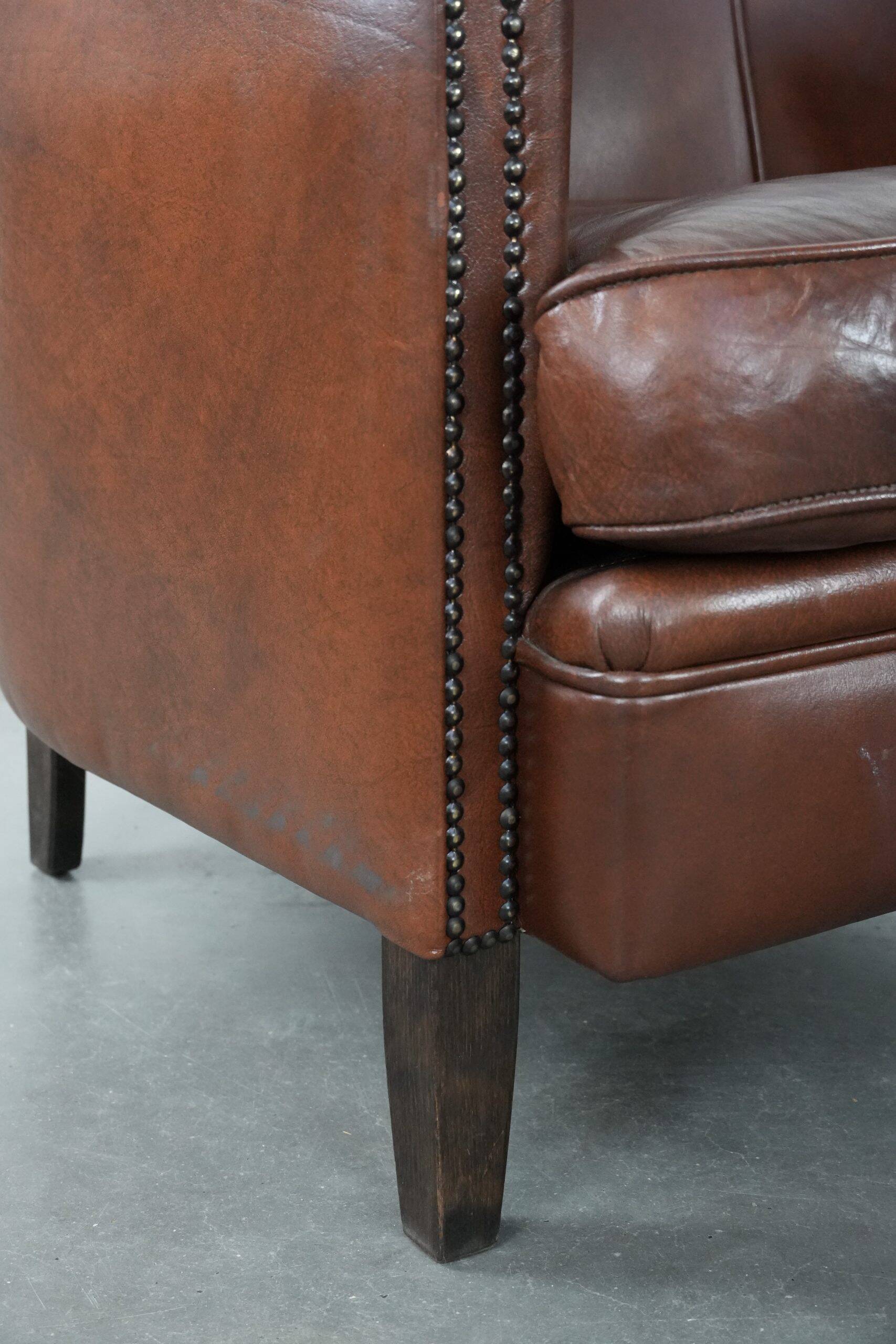 Unique set of two cognac-coloured cow leather club armchairs