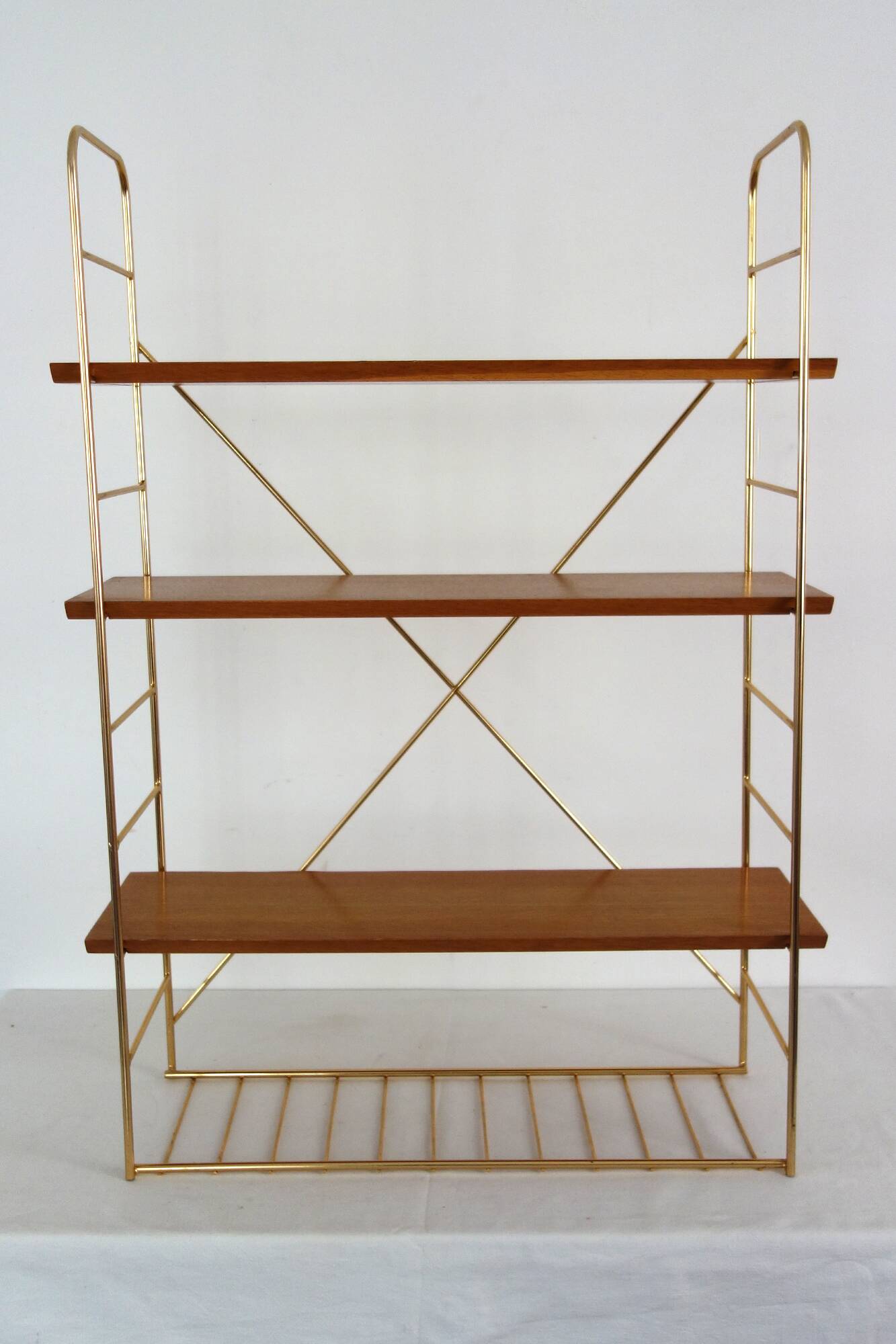String wall shelf in gold metal and wood from the 60s