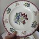 Set of 5 flat plates, signed Longwy.