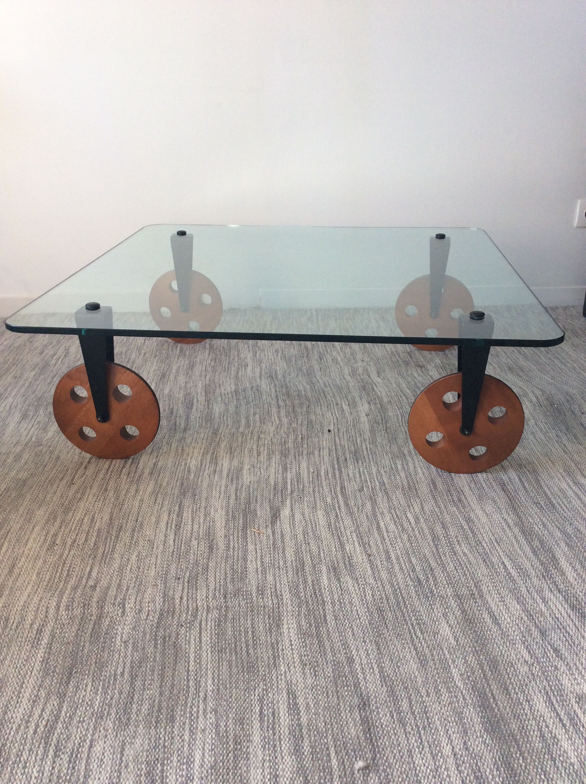 Glass coffee table on teak wheels