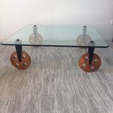 Glass coffee table on teak wheels