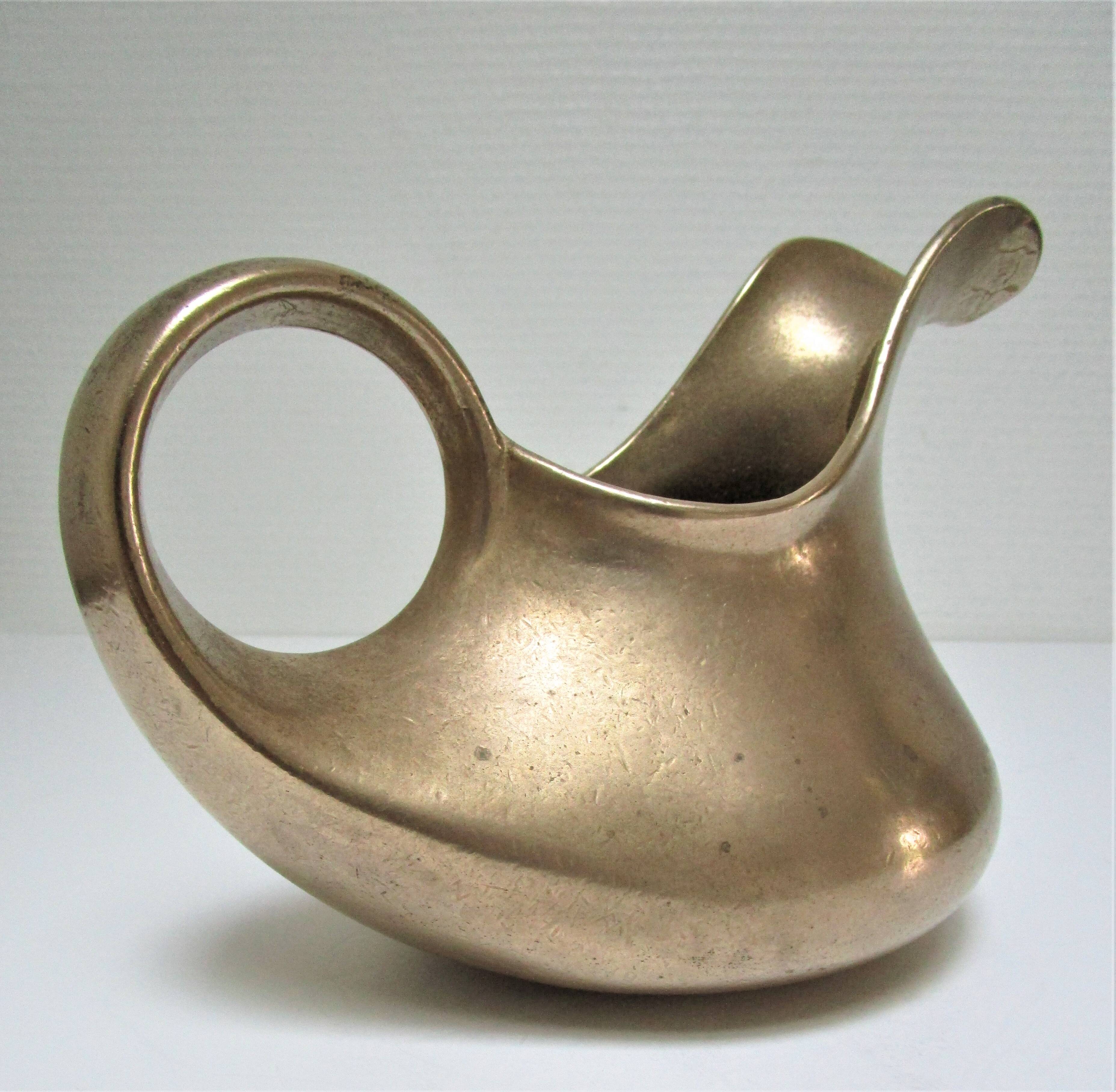 Stylized sculptural solid brass vase with handle