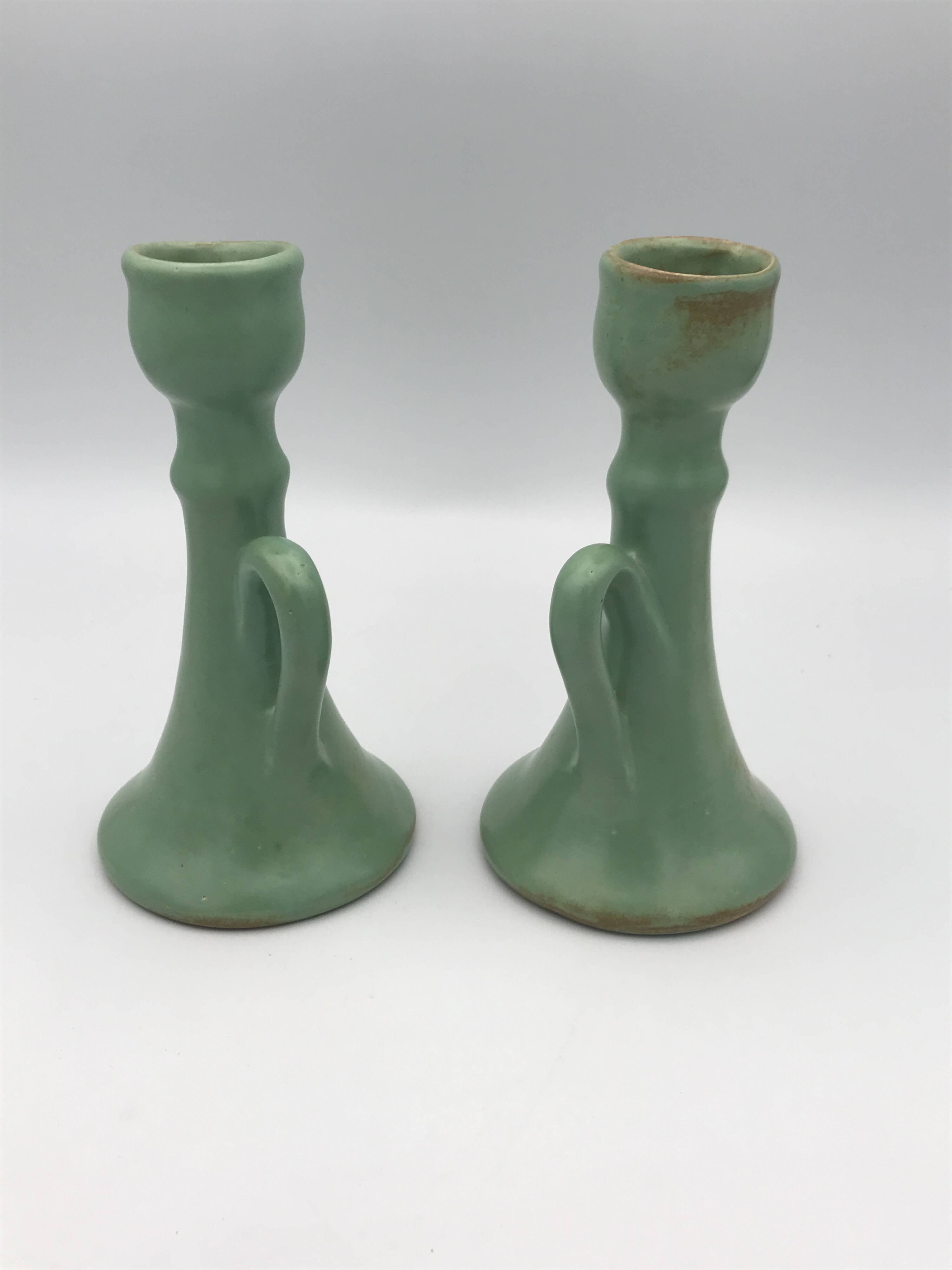 Pair of vintage table candle holders in green enameled ceramic