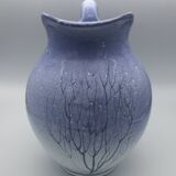 Blue glazed terracotta pitcher with hand-painted decoration, signed