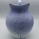Blue glazed terracotta pitcher with hand-painted decoration, signed