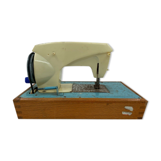 OLD BAKELITE SEWING MACHINE BASED ON WOOD AND METAL