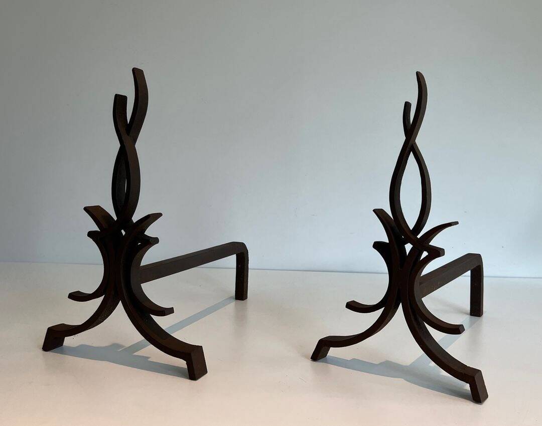 Pair of Wrought Iron Andirons with Stylised Flamboyant Uprights and Enrobed Feet
