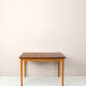 Scandinavian table with sliding panels.