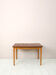 Scandinavian table with sliding panels.