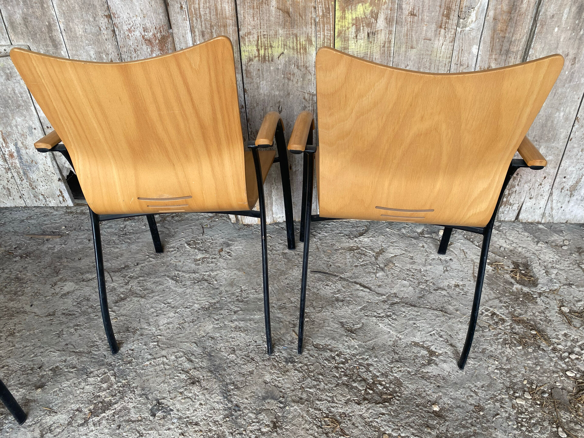 Pair of Vintage RONÉO Armchairs with Black Metal Legs + Curved Wooden Shell