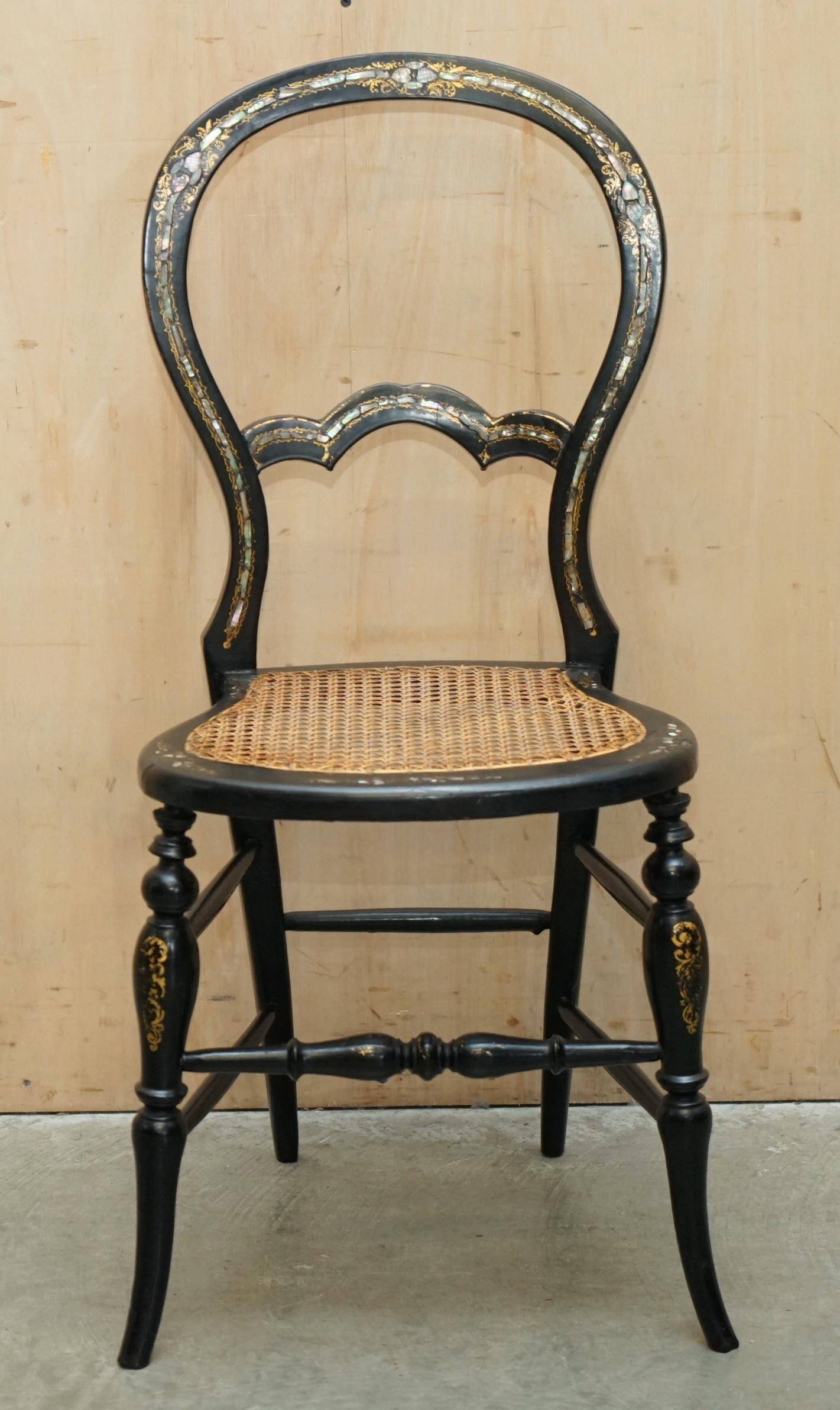 Four antique Regency bergère chairs with mother-of-pearl inlay.
