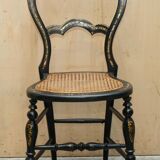 Four antique Regency bergère chairs with mother-of-pearl inlay.