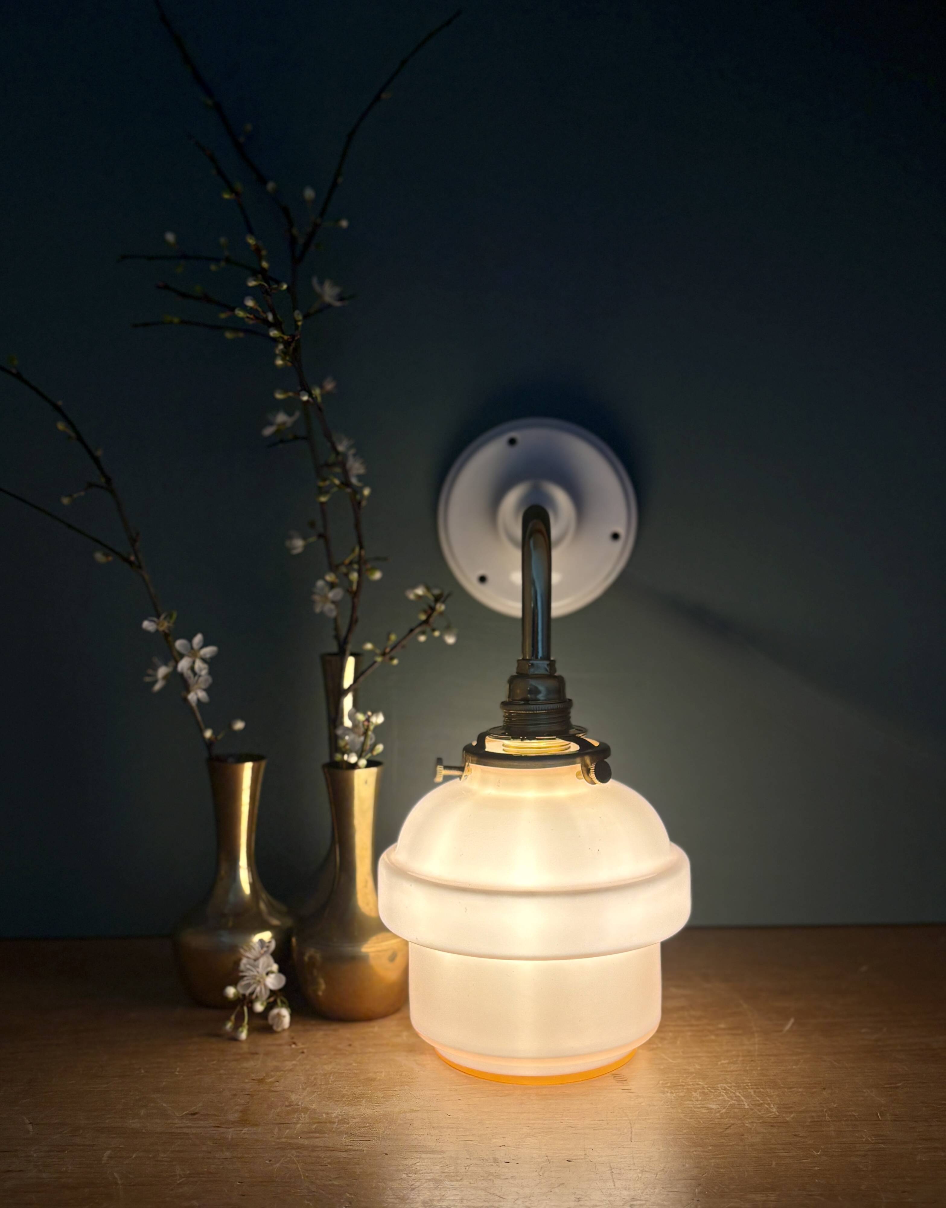 Vintage pink opaline globe wall light.