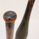 Pair of large wooden practice skittles on a base, early 20th century
