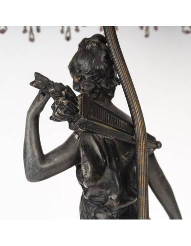 Art Nouveau style lamp with bronze sculpture and glass shade