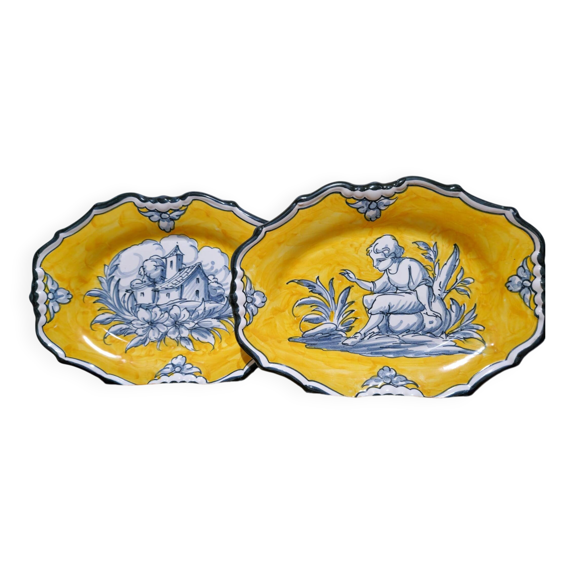 Pair of oval dishes in hand-painted faience with an Italian majolica spirit.