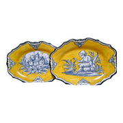 Pair of oval dishes in hand-painted faience with an Italian majolica spirit.