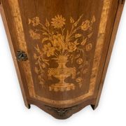 Louis XVI style corner buffet with marquetry decoration featuring a vase of flowers