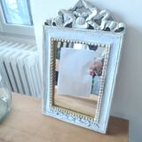 Mirror with ornament