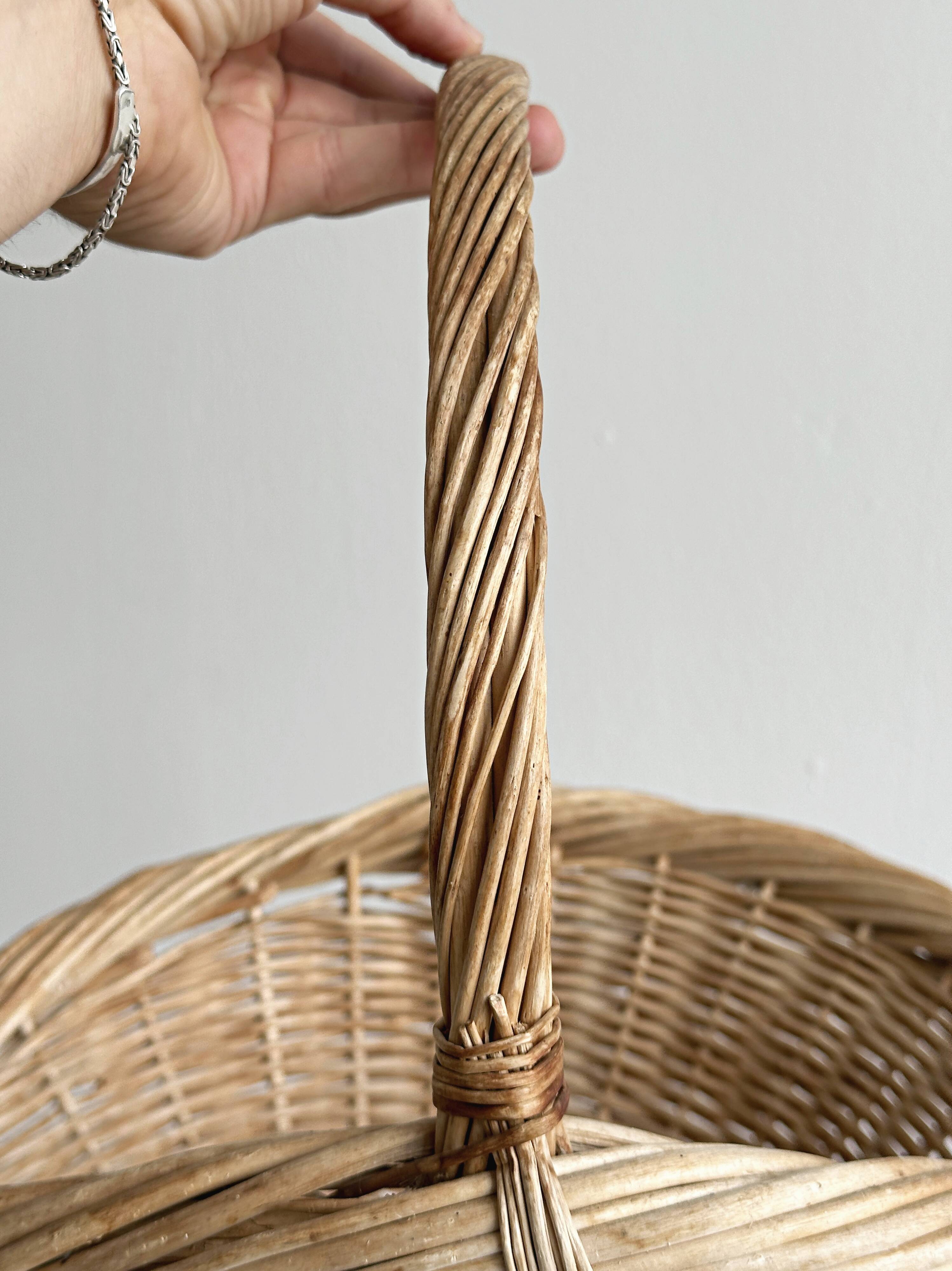 Large antique woven wicker basket with handle.