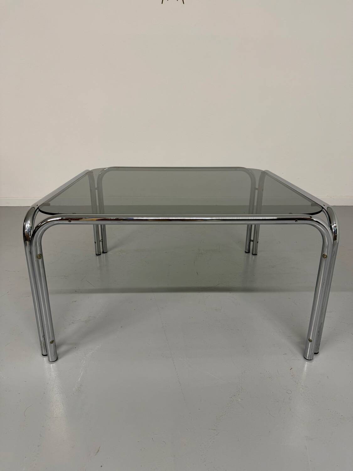 Space coffee table from the 70s, tubular metal and vintage smoked glass