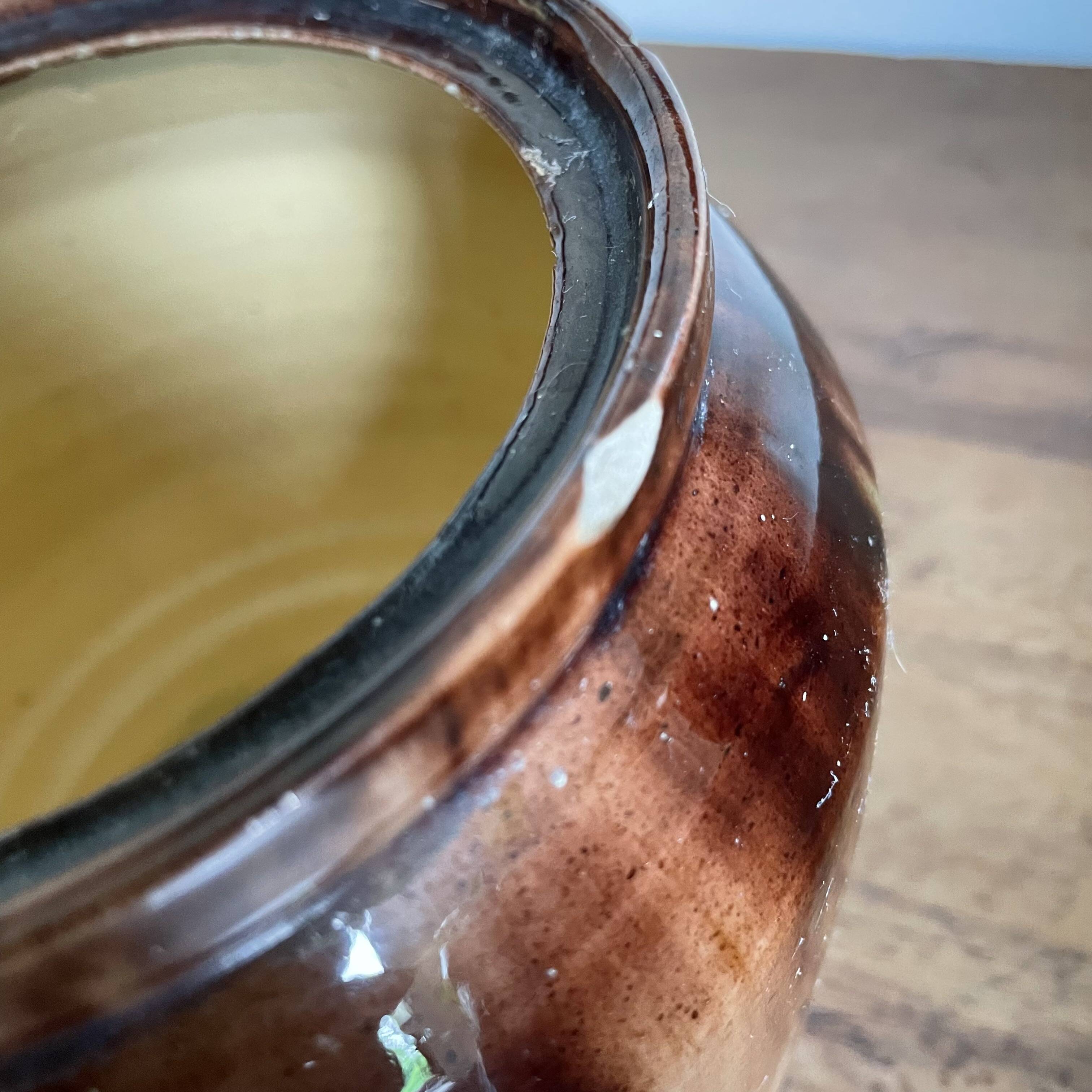 Glazed terracotta covered pot