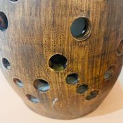 Terracotta lamp with cut-outs, circa 1970.