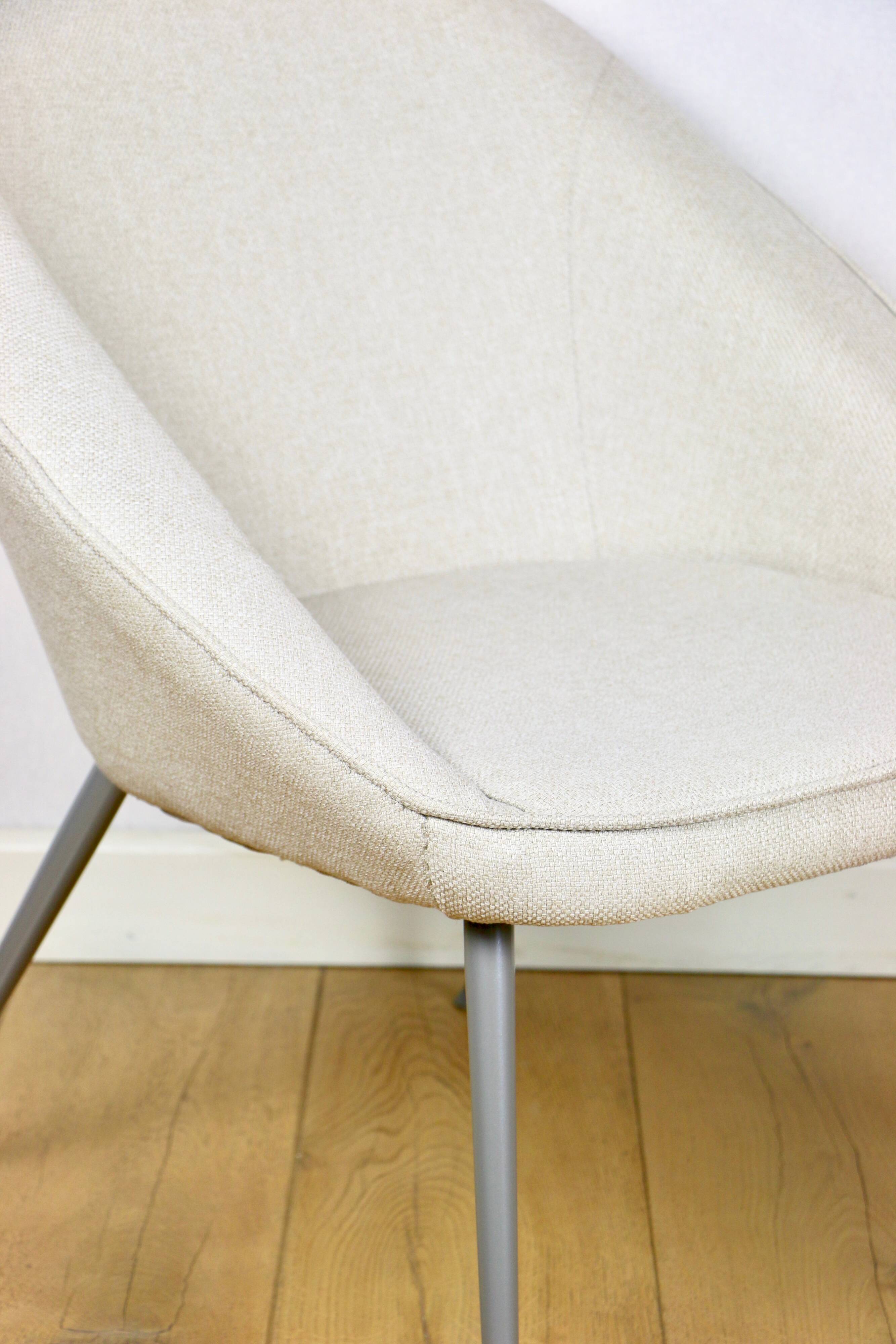 Beige ivory shell armchair from the 70s on grey metal legs - beautiful