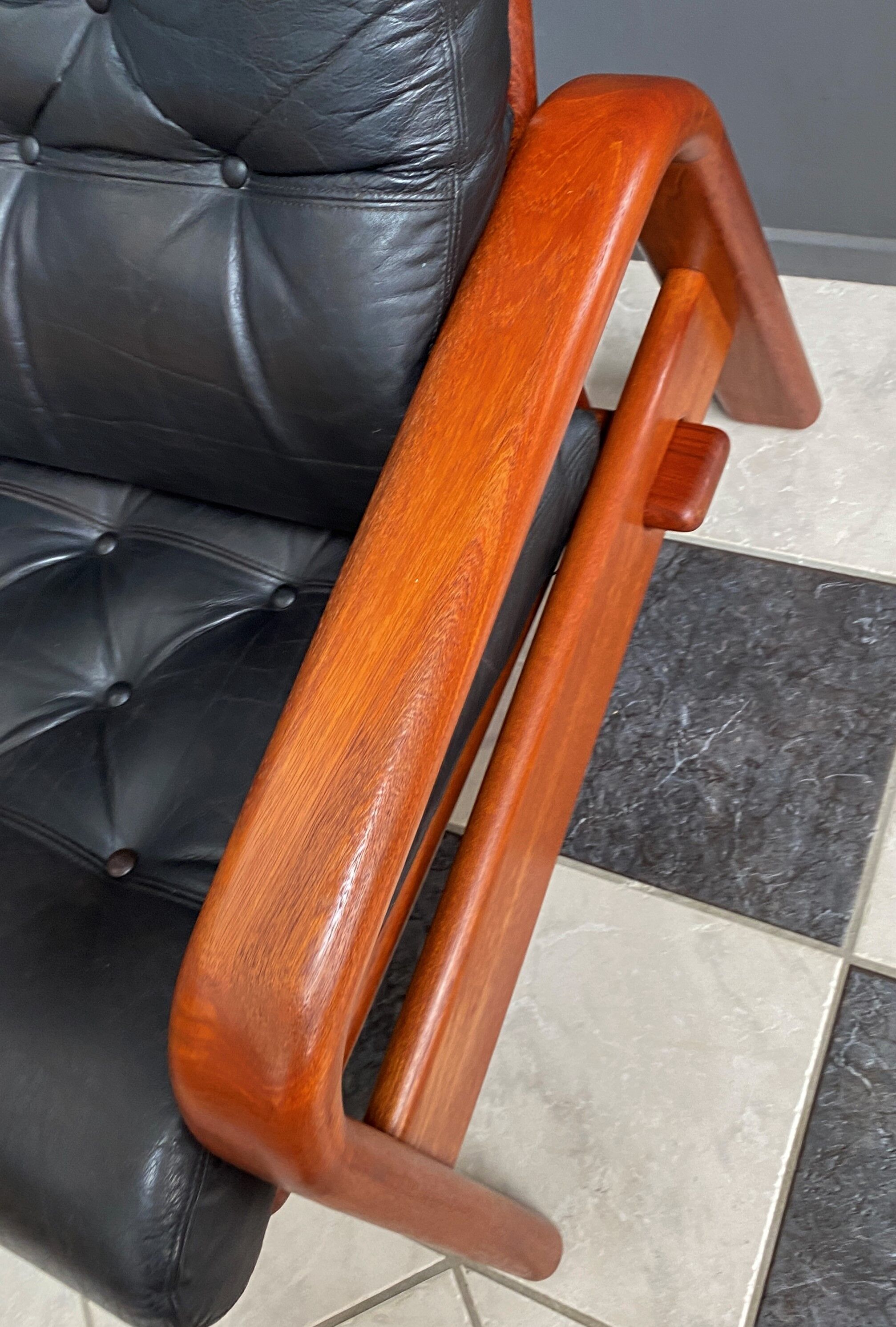 Teak and Black Leather 32 seat sofa by HS Denmark 1970s