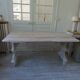 Console table in walnut with drop-leaf extensions, grey patinated base.