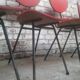 Lot of 6 red chairs in faux leather metal compass feet