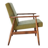 Mid-century modern armchair in olive green bouclé design by H. Lis.